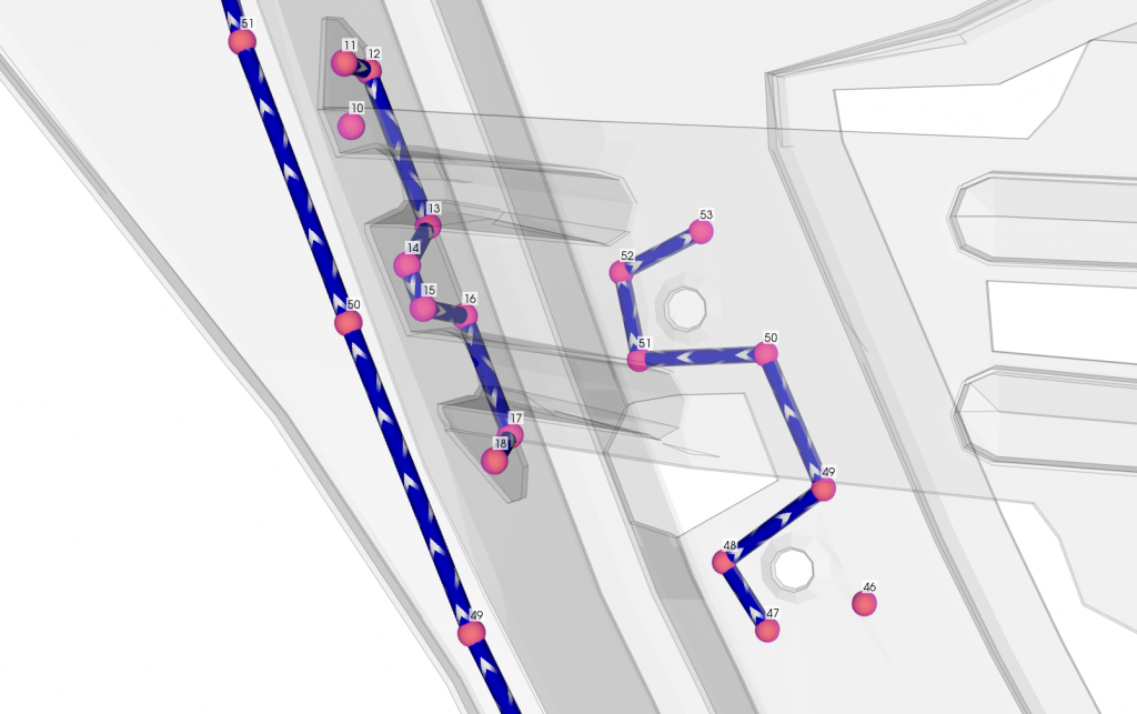 A screenshot of RoboLive® in action, showing a CAD model with paths and parameters visualized.